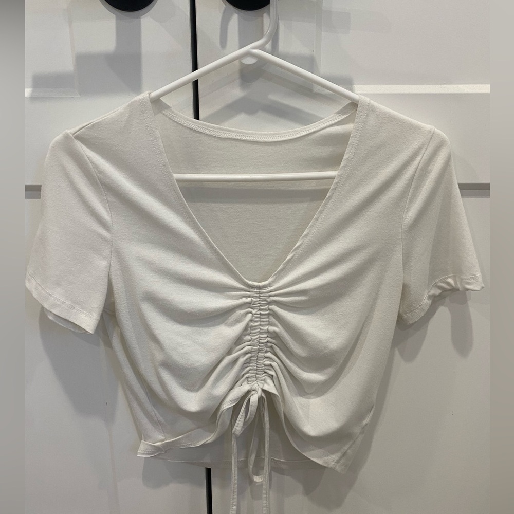 White adjustable scrunch crop top.
